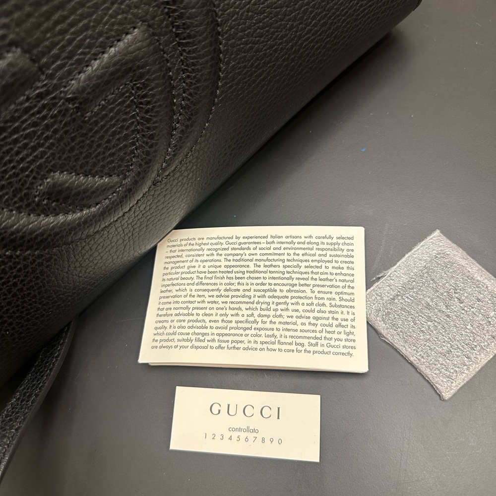 Gucci Textured Black Leather Handbag.